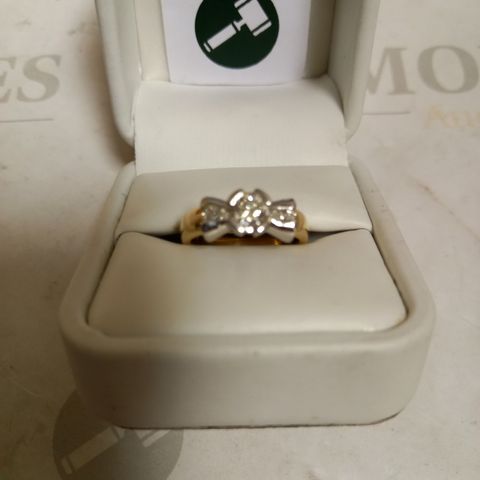 18CT GOLD RING SET WITH A ROUND DIAMOND AND A MARQUISE TO EACH SHOULDER