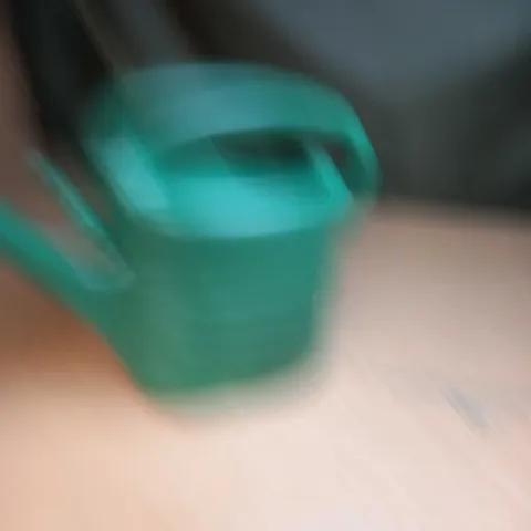 GREEN PLASTIC WATERING CAN