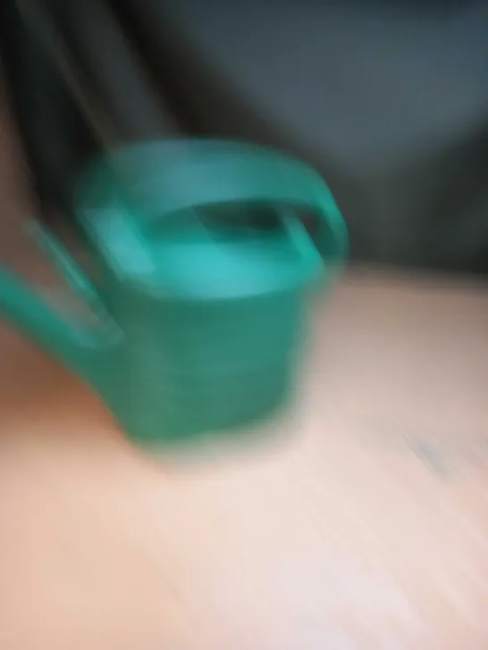 GREEN PLASTIC WATERING CAN