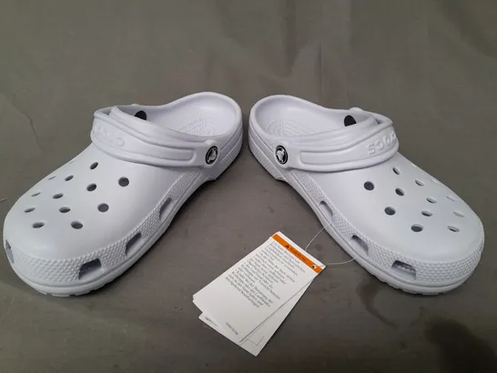 PAIR OF CROCS CLASSICS IN PALE BLUE UK SIZE M3/W4