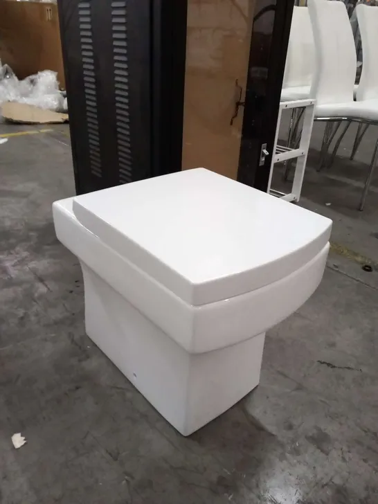 THREE WHITE CERAMIC WC PANS WITH CISTERN AND SHATAFF