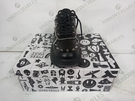 BOXED PAIR OF KOI PLATFORM TRAINERS IN BLACK W. SILVER EFFECT CHAINS & CHARMS SIZE 4