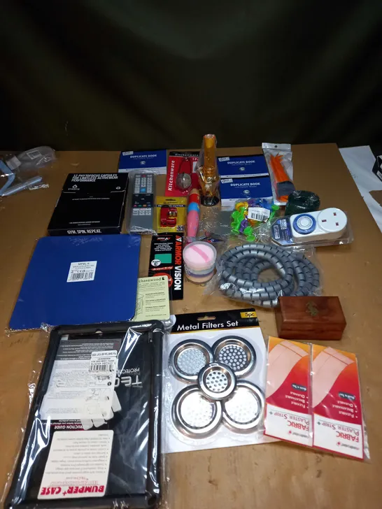 LOT OF ASSORTED ITEMS TO INCLUDE IPAD CASES, METAL FILTERS AND DUPLICATE BOOKS