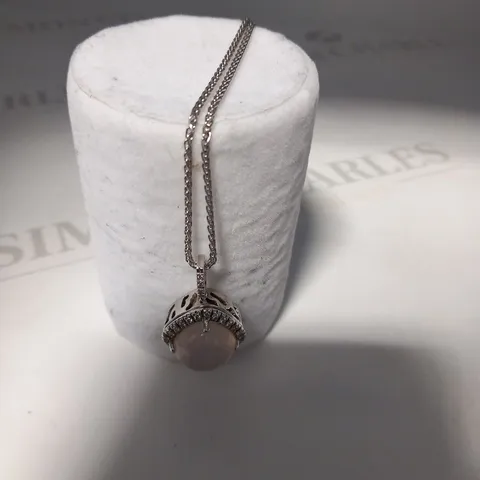 DESIGNER 18CT WHITE GOLD PENDANT ON CHAIN, SET WITH A ROSE QUARTZ CABACHON WITH DIAMOND HALO