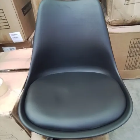 A BOXED BLACK UPHOLSTERED OFFICE CHAIR 