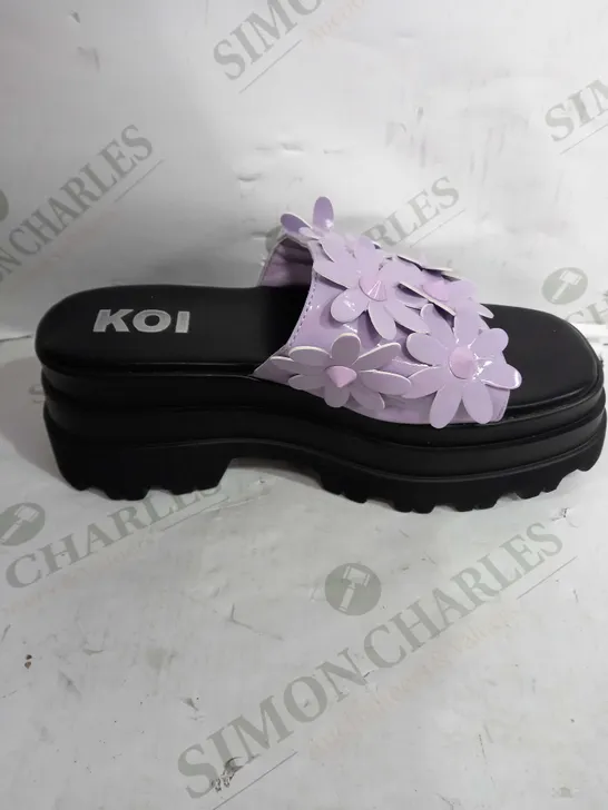 PAIR OF KOI VEGAN LEATHER PLATFORM SQUARE TOE SANDALS IN BLACK WITH PURPLE FLOWER DESIGN - SIZE 6