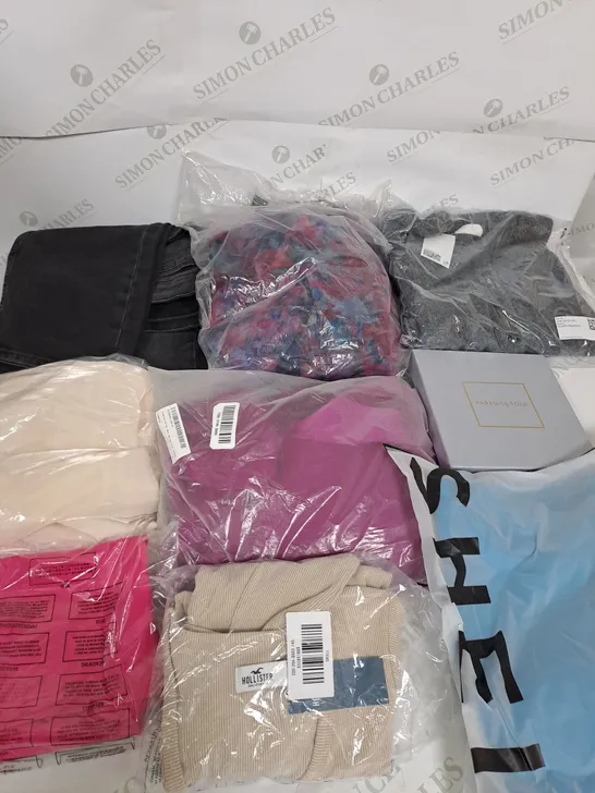 LARGE BOX OF ASSORTED CLOTHING ITEMS IN VARIOUS COLOURS AND SIZES INCLUDING TROUSERS , TOPS AND JUMPERS 