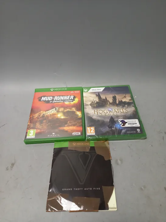 LOT OF 3 XBOX ONE VIDEO GAMES TO INCLUDE GRAND THEFT AUTO 5, HOGWARTS LEGACY AND MUD RUNNER