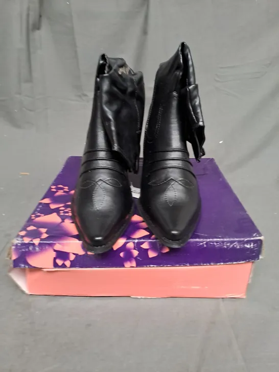 BOXED LOT OF 9 PAIRS OF LADIES BLACK BOOTS. VARIOUS SIZES