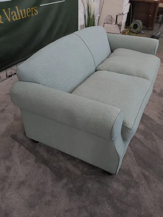 THE CHILMARK 3-SEATER SOFA UPHOLSTERED IN AQUA FABRIC