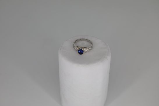 18CT WHITE GOLD RING SET WITH AN OVAL CUT TANZANITE AND PAVE DIAMOND SHOULDERS, TOTAL WEIGHT +0.91CT RRP £1500