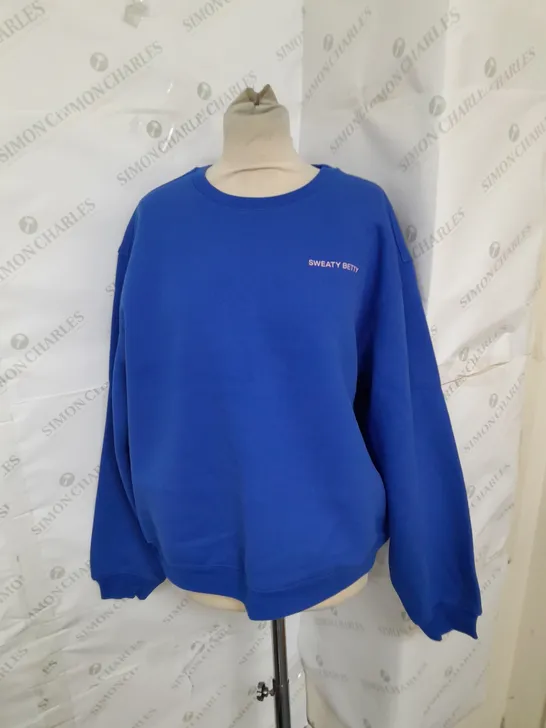 SWEATY BETTY ELEVATED SWEATSHIRT IN LIGHTENING BLUE SIZE M