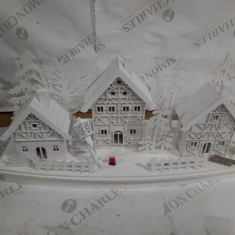 WHITE WOOD LIT VILLAGE SCENE