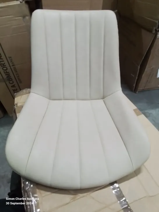 A BOXED PAIR OF FAUX LEATHER LIGHT TAN SIDE CHAIRS