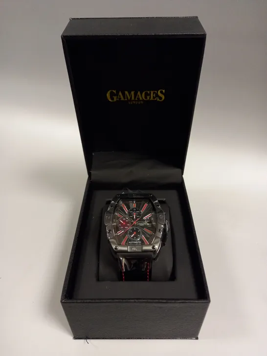 BOXED GAMAGES GALACTIC BLACK TRIPLE DATE DIAL RED STRIPE AUTOMATIC LEATHER STRAP WRISTWATCH	