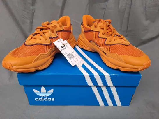 BOXED PAIR OF ADIDAS OZWEEGO SHOES IN ORANGE UK SIZE 6