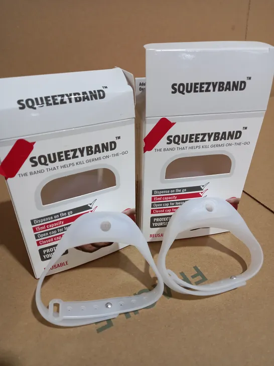 LOT OF 2 SQUEEZYBAND PORTABLE HAND SANITIZER DISPENSERS