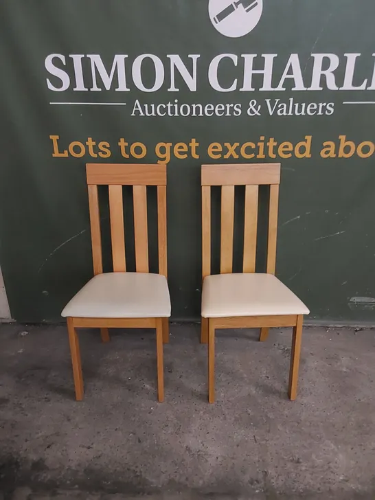SET OF 2 CHESTER OAK DINING CHAIRS WITH IVORY LEATHER SEAT PADS 