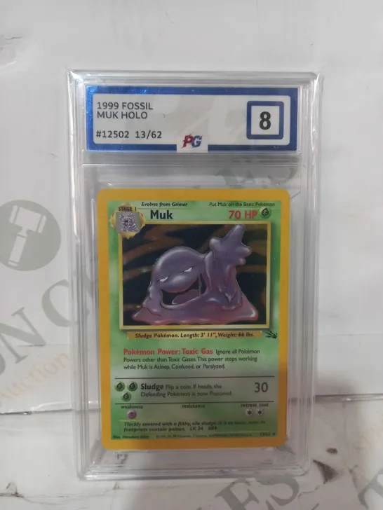 FRAMED AND GRADED COLLECTIBLE POKÉMON TRADING CARD - MUK HOLO (1999 FOSSIL)