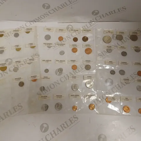 COLLECTION OF ASSORTED COINS IN VARIOUS CURRENCIES FROM AROUND THE WORLD