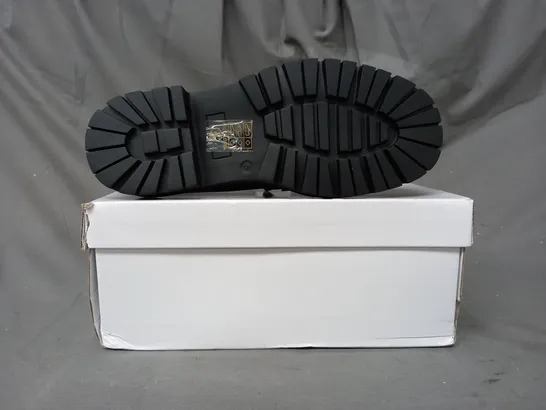 BOXED PAIR OF TRUFFLE COLLECTION LOAFERS IN GLOSSY BLACK W. GOLD EFFECT DETAIL SIZE 5