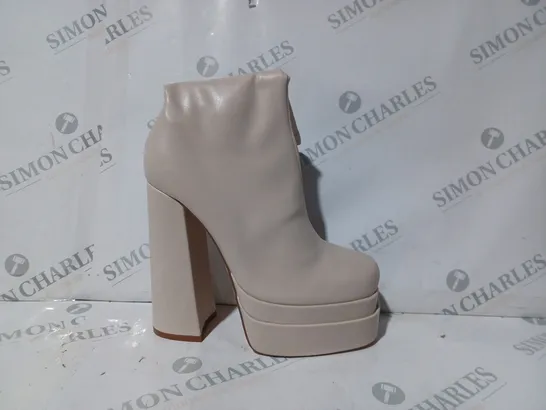 BOXED PAIR OF TRUFFLE COLLECTION PLATFORM HIGH BLOCK HEEL BOOTS IN CREAM SIZE 7