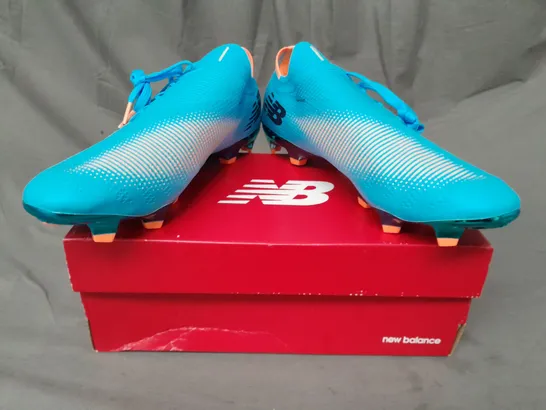 BOXED PAIR OF NEW BALANCE FURON FOOTBALL BOOTS IN SKY BLUE/ORANGE UK SIZE 10.5