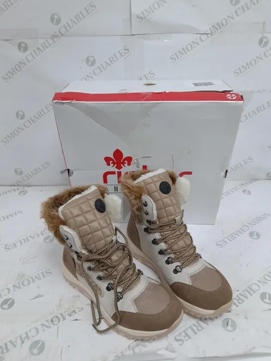 BOXED PAIR OF RIEKER CREAM WINTER FUR HIKE BOOTS IN SIZE 5 