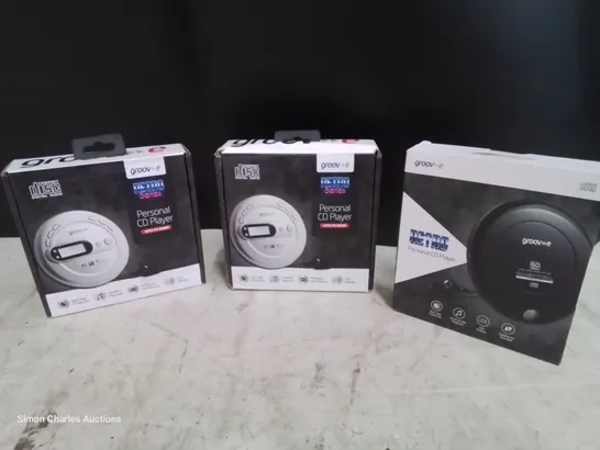 CASE OF APPROXIMATELY 216 GROOVE RETRO SERIES PERSONAL CD PLAYERS