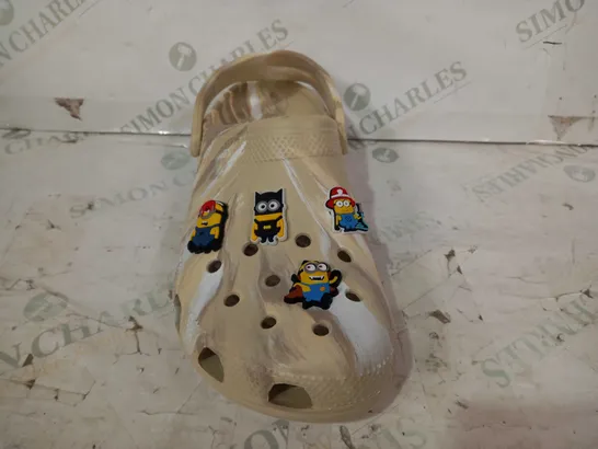 BOXED PAIR OF CROCS CLASSIC MARBLED CLOGS IN SAND COLOUR W. MINIONS CHARMS SIZE M11