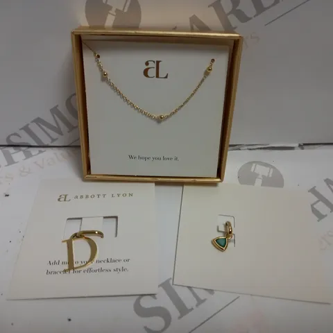 BOX OF 3 ABBOTT LYON ITEMS INCLUDING GOLD EFFECT NECKLACE WITH `D` PENDANT AND MAY BIRTHSTONE PENDANT