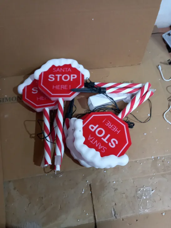 FESTIVE SET OF PRELIT SANTA STOP HERE STAKES