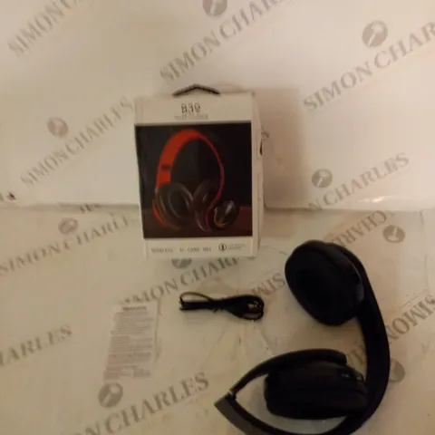 BOXED WIRELESS HEADPHONES WITH AUDIO CABLE AND INSTRUCTIONS