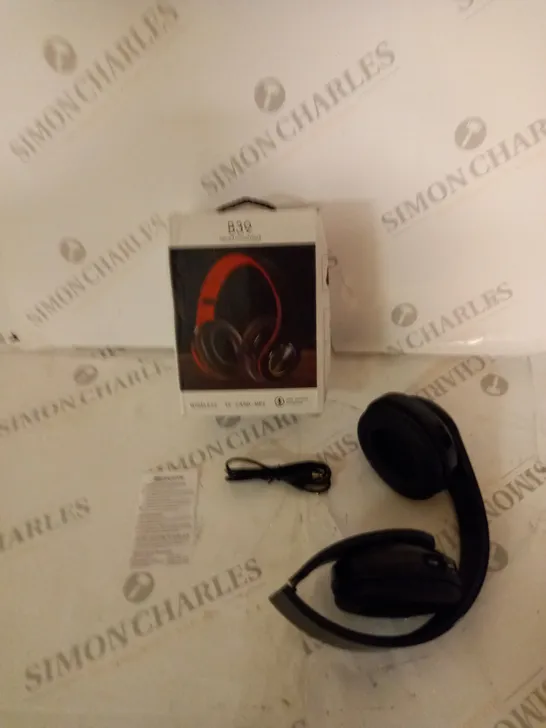 BOXED WIRELESS HEADPHONES WITH AUDIO CABLE AND INSTRUCTIONS