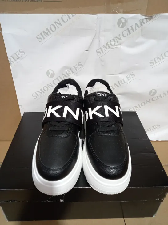 BOXED PAIR OF DKNY MADIGAN SLIP ON TRAINERS SIZE 6