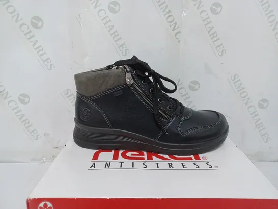 BOXED PAIR OF RIEKER WATER RESISTANT BOOTS IN BLACK SIZE 7.5 