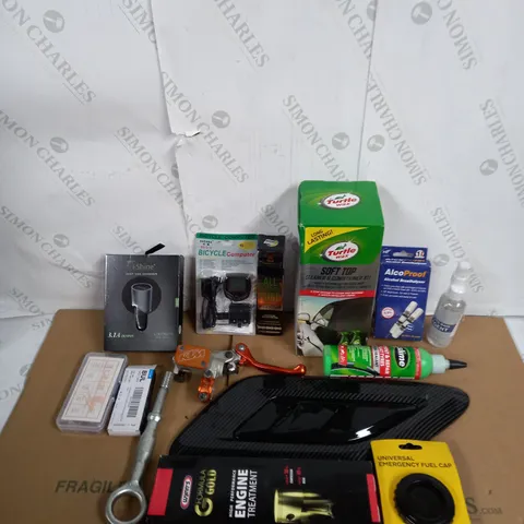 LOT OF ASSORTED VEHICLE ITEMS TO INCLUDE ENGINE TREATMENT, CAR CHARGER AND EMEGENCY FUEL CAP