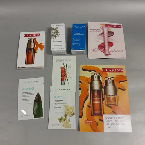 8 X ASSORTED CLARINS BEAUTY PRODUCTS TO INCLUDE GLOSS, EYE SERUM, CLEANSING GEL ETC 
