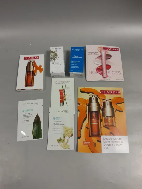 8 X ASSORTED CLARINS BEAUTY PRODUCTS TO INCLUDE GLOSS, EYE SERUM, CLEANSING GEL ETC 