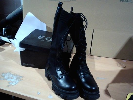 BOXED PAIR OF EGO SAINT BOOTS BLACK SIZE 5