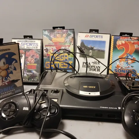 SEGA MEGADRIVE WITH TWO CONTROLLERS AND 5 GAMES