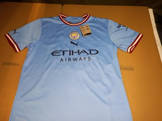 Manchester city home top parker on the back