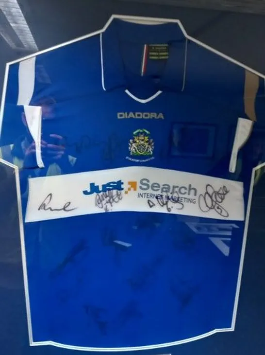 FRAMED, MOUNTED AND SIGNED STOCKPORT COUNTY FC HOME JERSEY