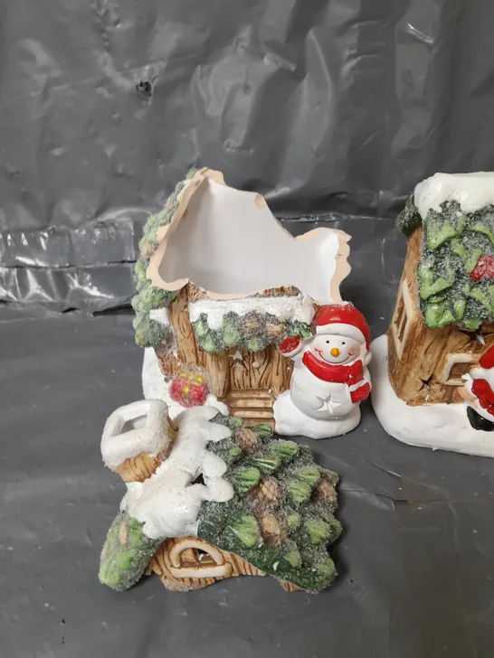 FESTIVE SET OF 2 LIT CERAMIC SANTA/SNOWMAN HOUSE CHRISTMAS DECORATIONS 