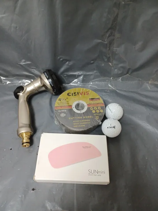 BOX OF APPROXIMATELY 10 ASSORTED HOUSEHOLD ITEMS TO INCLUDE GOLF BALLS, NAIL LAMP AND CUTTING WHEELS 