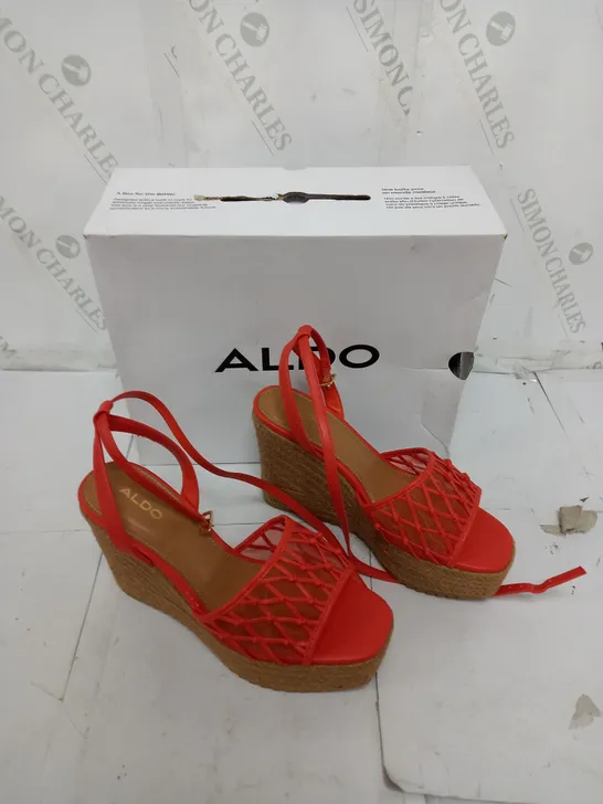 BOXED PAIR OF ALDO DELLEN WEDGE HEELS IN ORANGE SIZE 4.5