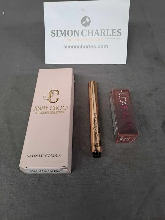 LOT OF 3 COSMETIC PRODUCTS TO INCLUDE - JIMMY CHOO SATIN LIP COLOUR, HUDA BEAUTY CREAM LIPSTICK AND YVESSAINTLAURENT RADIANT TOUCH 