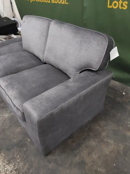 DESIGNER 2-SEATER UPHOLSTERED IN SOFT FABRIC 