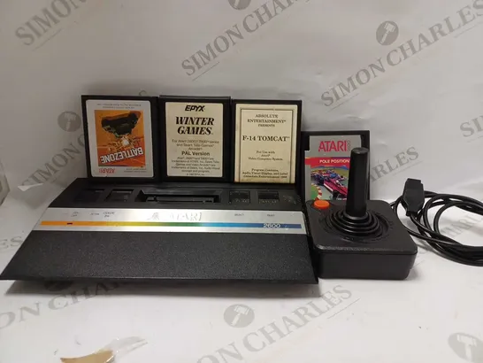 ATARI GAMES CONSOLE WITH 4 GAME CARTRIDGES