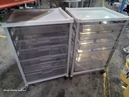 TWO METAL FRAMED TROLLEYS WITH 5 CLEAR PLASTIC GRADUATED TRAYS